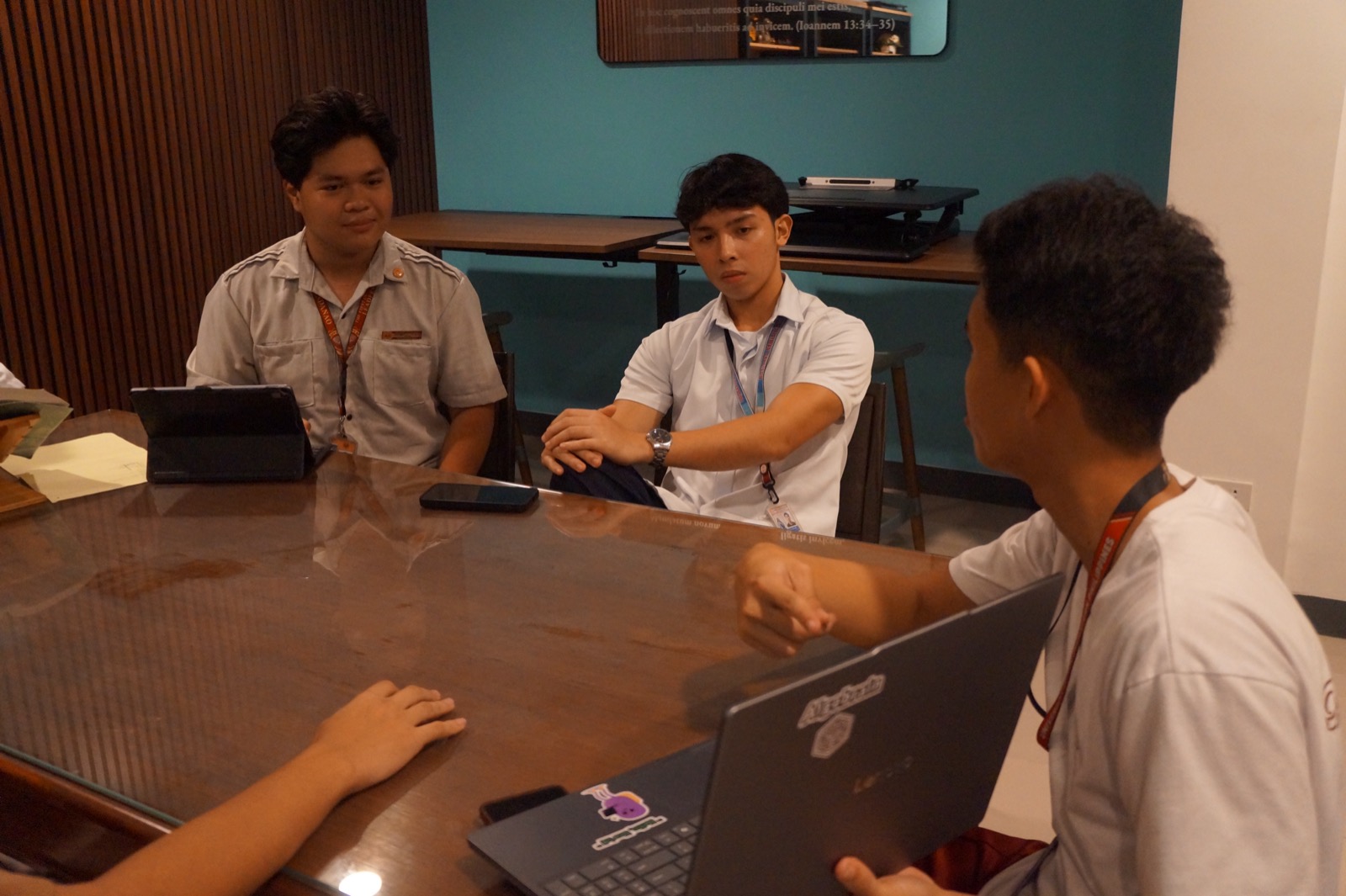 A small group of KOTA students studying together with laptops