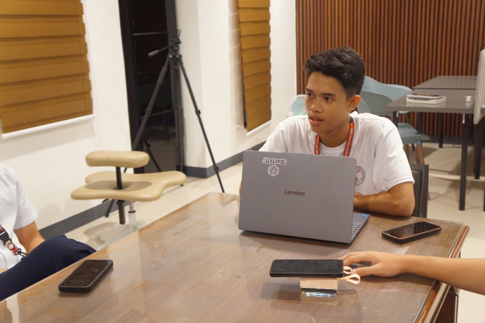 A KOTA student discussing a lesson with an open laptop